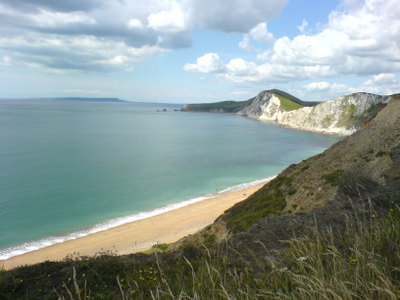 View of white cliffs and beach during descent