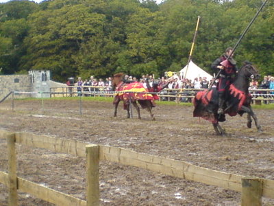 the red knight losing a lance to the evil black knight from the depths of hell, Lord Odeous...
